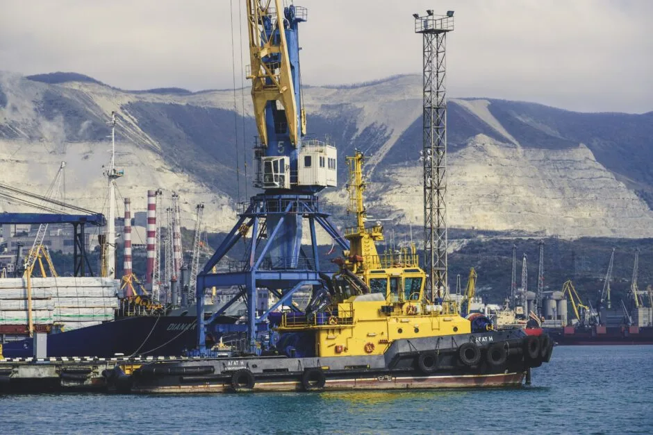 a yellow and black boat in a body of water